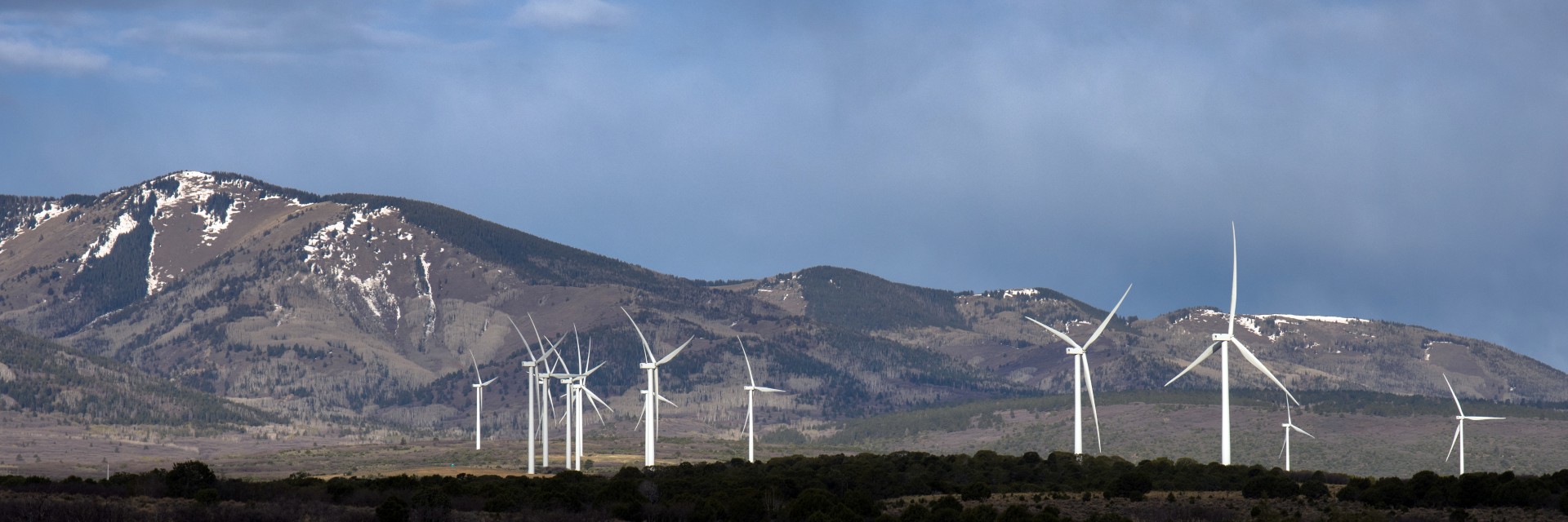 wind mills with utah mountain backdrop