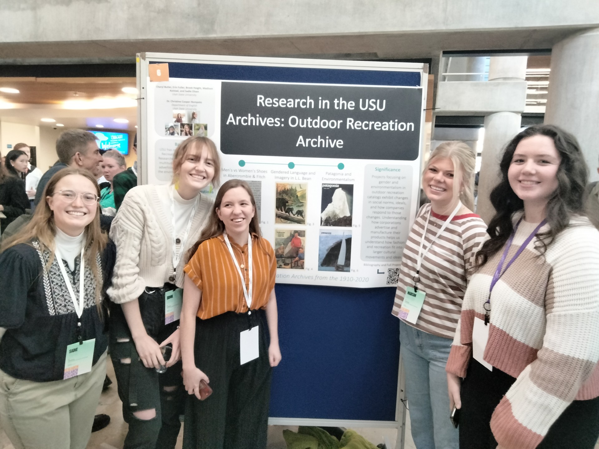Students in front of a poster presentation on Outdoor Recreation Archive