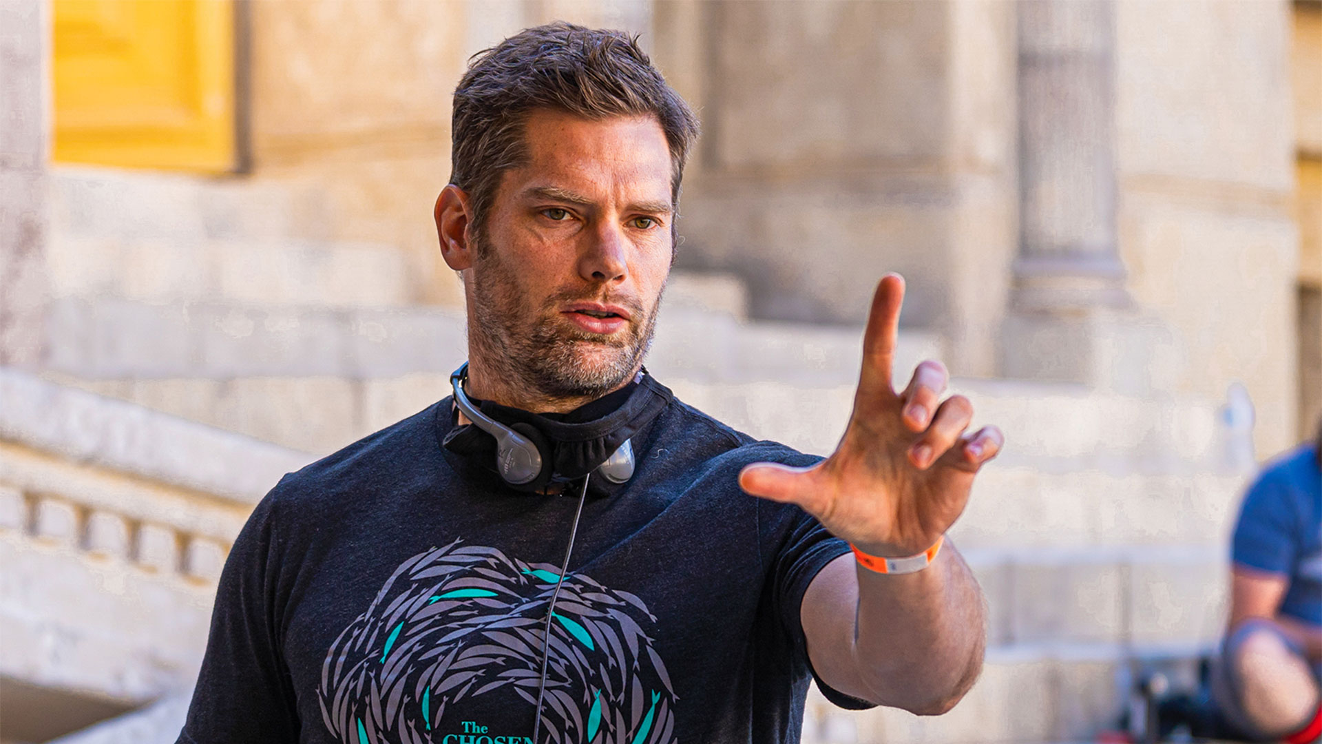 Dallas Jenkins with his fingers framing a shot of a videoe shoot