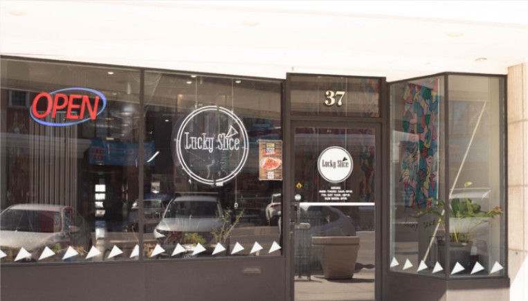 Lucky Slice window sign.