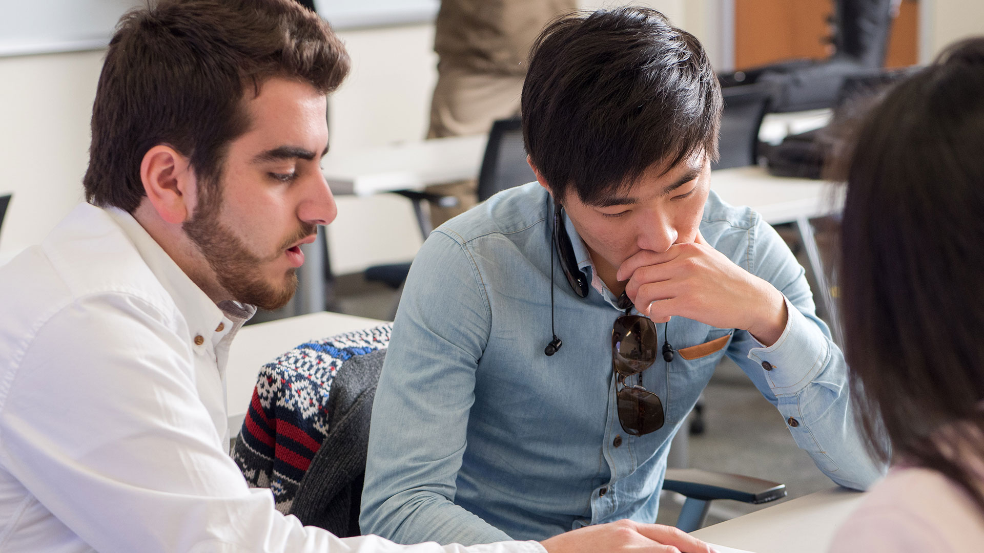 2 students think over some papers