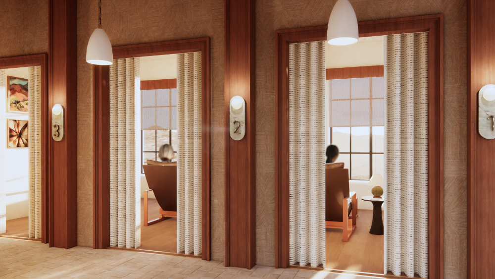 This interior rendering features a tranquil hallway lined with private treatment rooms, each
marked by elegant stone-mounted numbers and soft wall sconces. Decorative privacy curtains
frame the entrances to the individual suites, which offer guests leather lounge chairs and
expansive window views of a sun-drenched desert landscape.