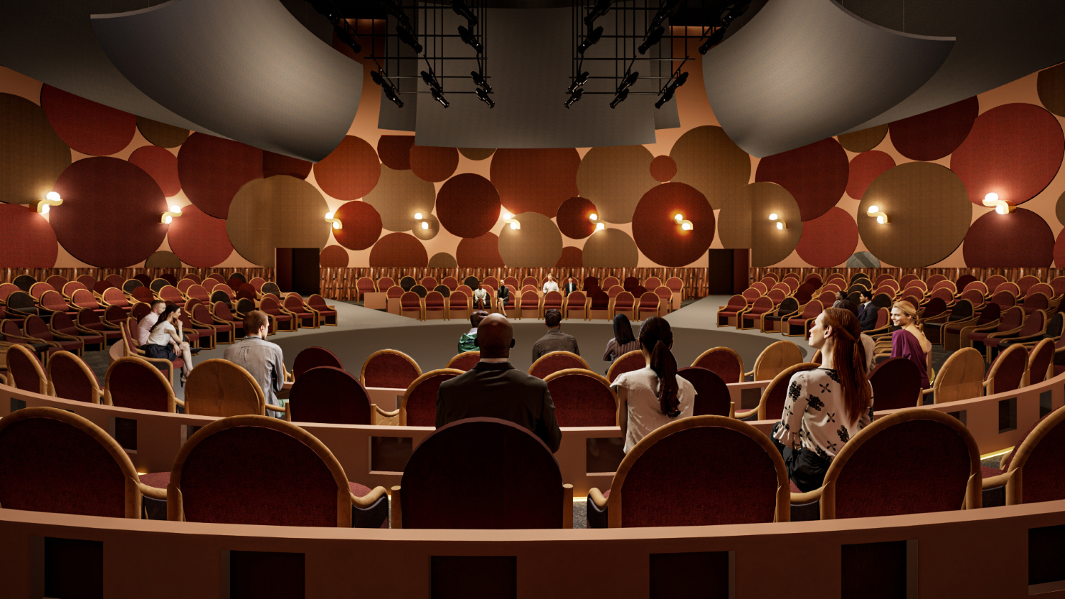 A theater in the round set up with seats on risers surrounding a central stage.
