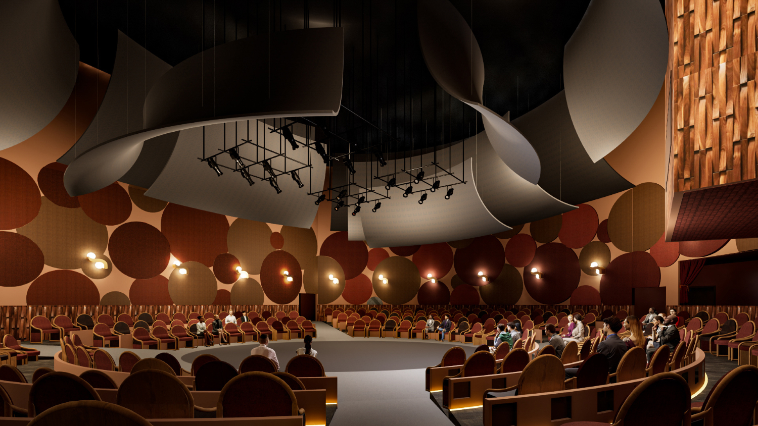 A theater in the round with seats surrounding the stage on risers