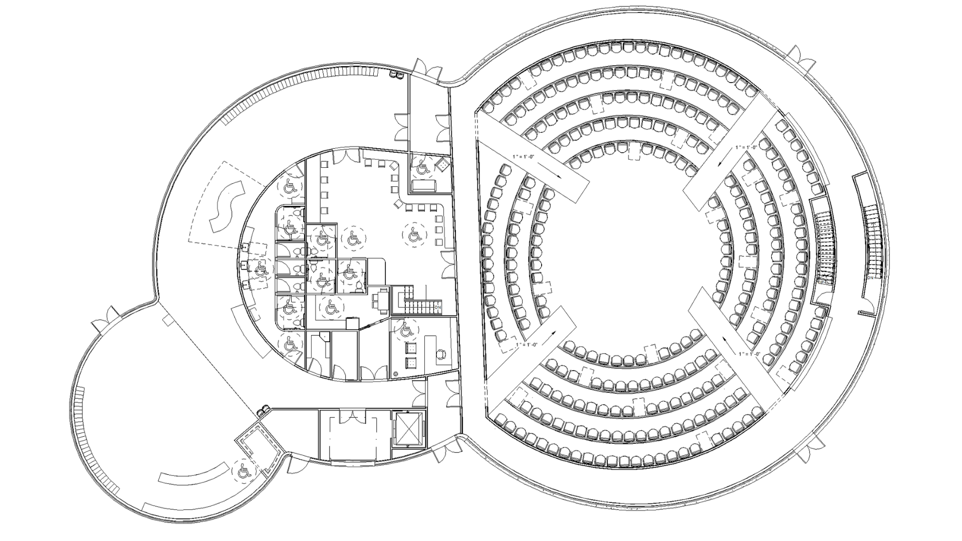A floor plan showing a theater with an arena-style stage set up and risers filled with non-fixed seats and empty spaces for wheelchair users.