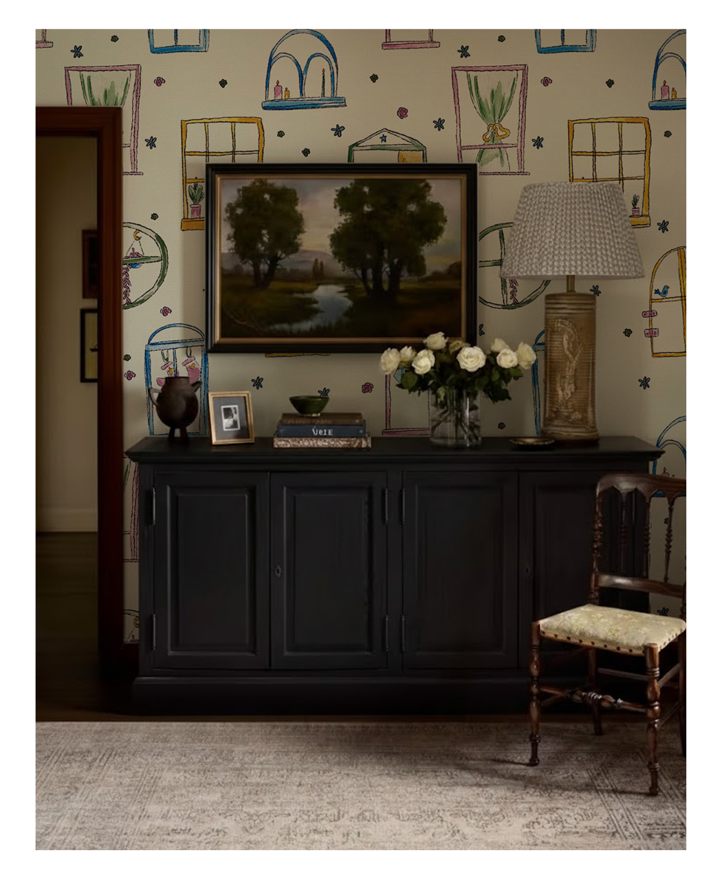 A vignette of the fifth wallcovering:
The Views put on the wall of an entry
way, with a credenza, lamp and framed
picture.