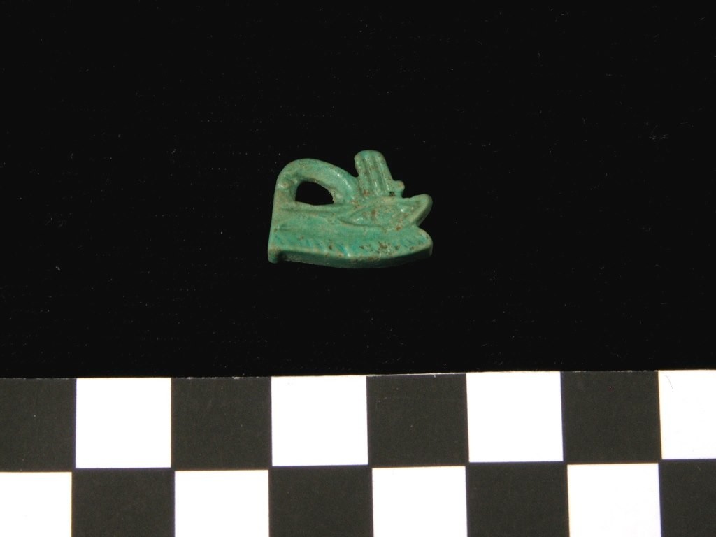 A small, green carved artifact.