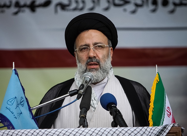 Iranian president Ebrahim Raisi speaks at a rally