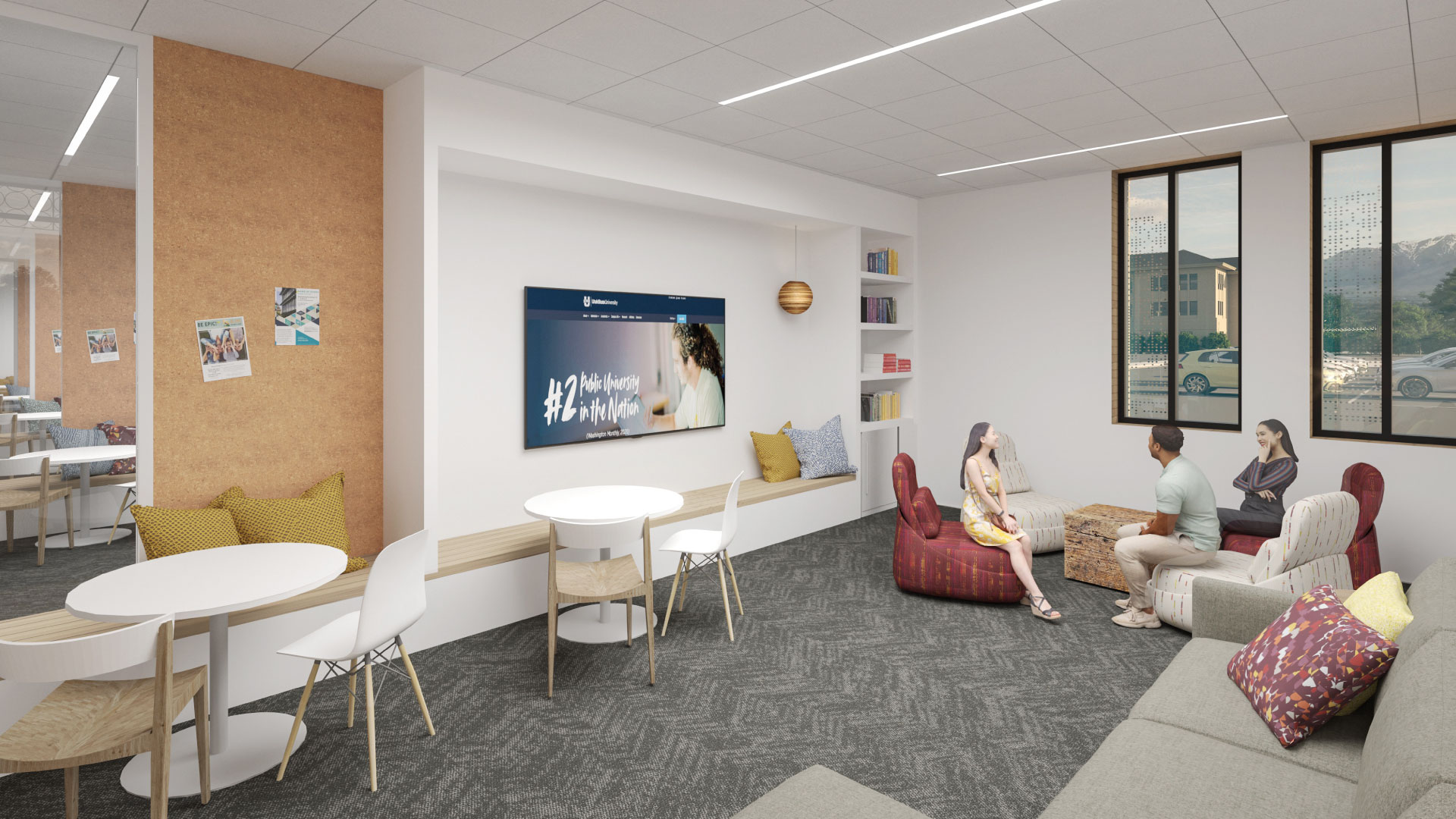 An open room with plenty of seating with displays on the walls.